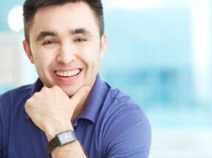 Man with oral appliance smiling